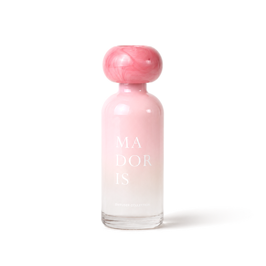 MADORIS Blush Veil reed diffuser with pink sculptural cap and frosted pink glass bottle