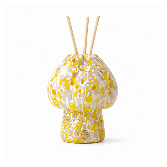 MADORIS Golden Hour reed diffuser with yellow sculptural glass vessel and natural reeds