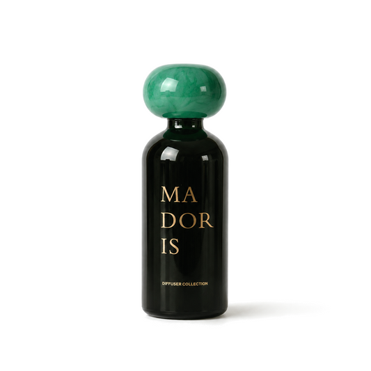 MADORIS Jade Mist reed diffuser with green sculptural cap and black glass bottle