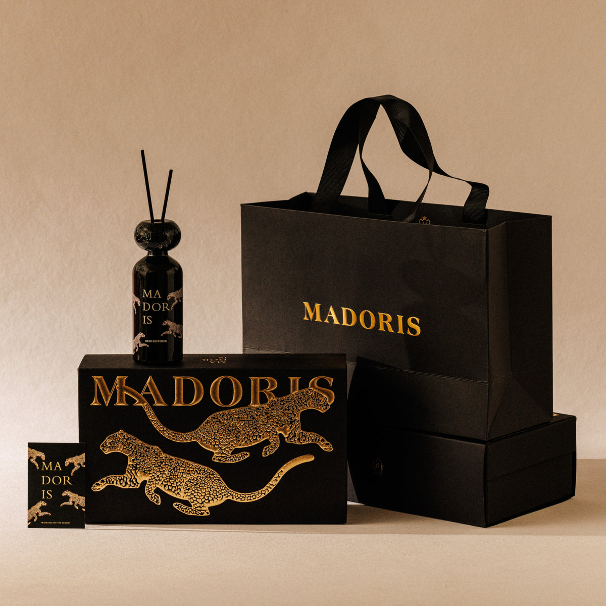 MADORIS Lucky Leopard reed diffuser with signature black and gold gift packaging