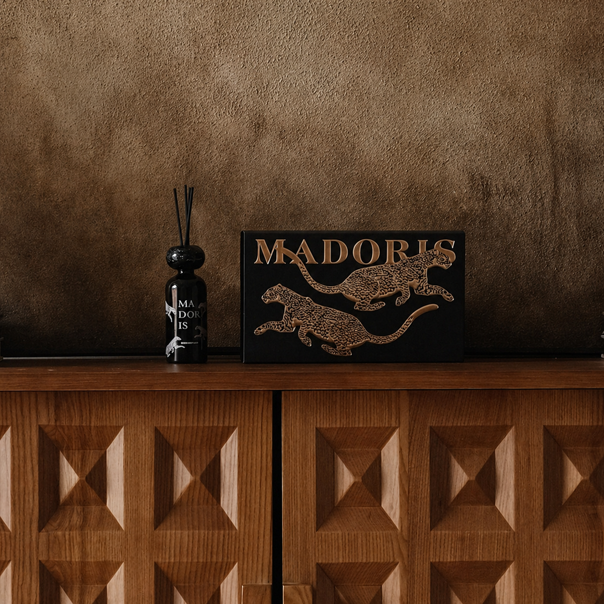 MADORIS Lucky Leopard reed diffuser styled in a warm brown interior setting