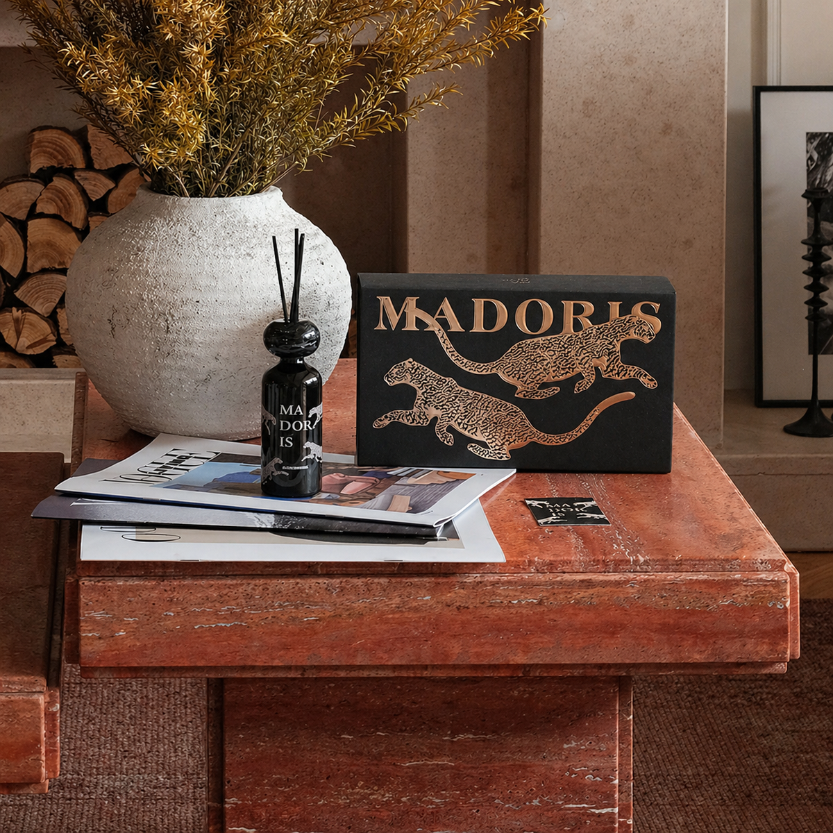 MADORIS Lucky Leopard reed diffuser displayed on a wooden table with sculptural decor
