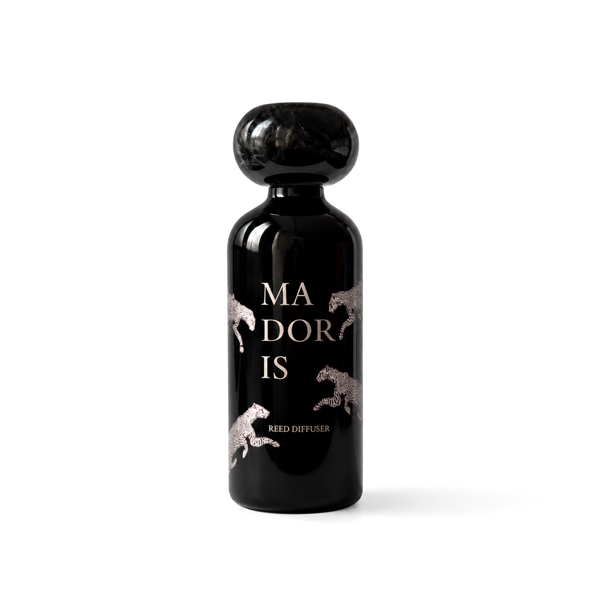 MADORIS Lucky Leopard reed diffuser with black sculptural cap and black glass bottle