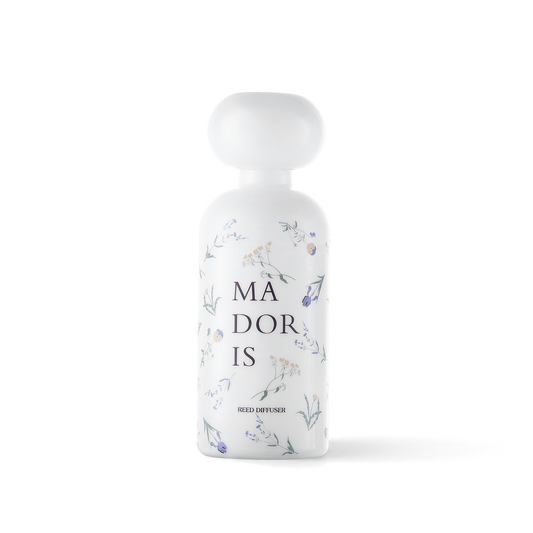 MADORIS White Whisper reed diffuser with white sculptural cap and white glass bottle